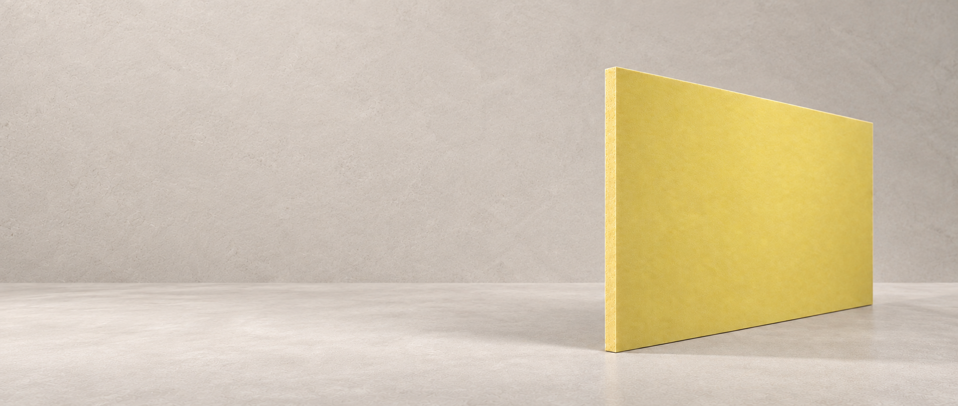 The smooth face and dense edge of a warm yellow mineral core board